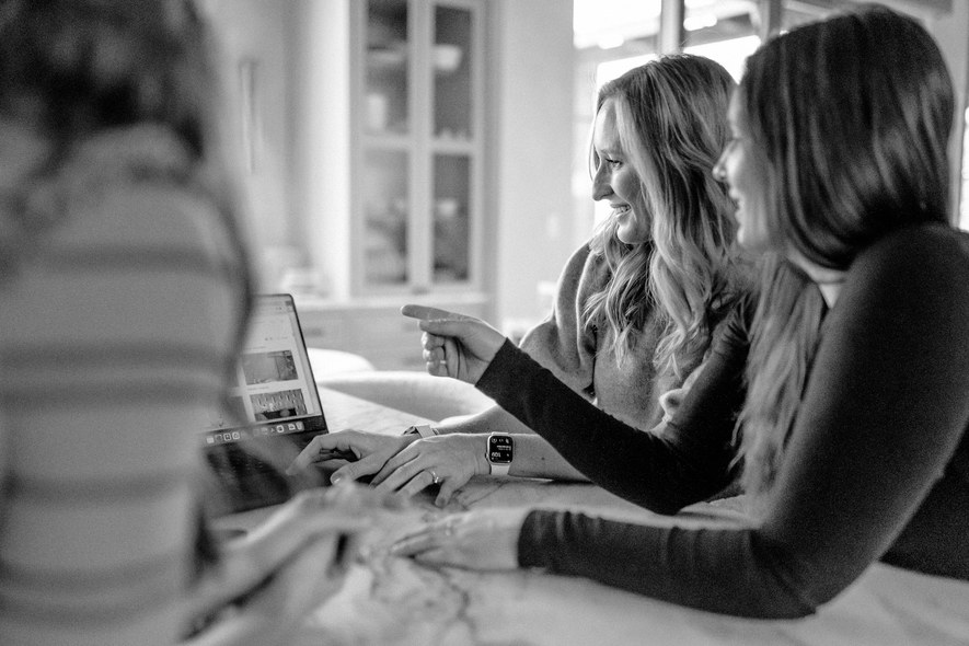 designers collaborating at laptop